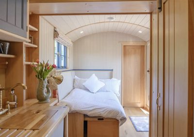 The sofa bed in the Mill Pond Shepherd's Hut