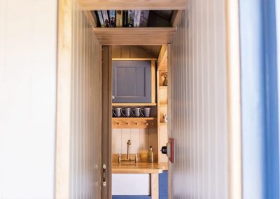 The kitchen inside the Mill Pond Shepherd's Hut